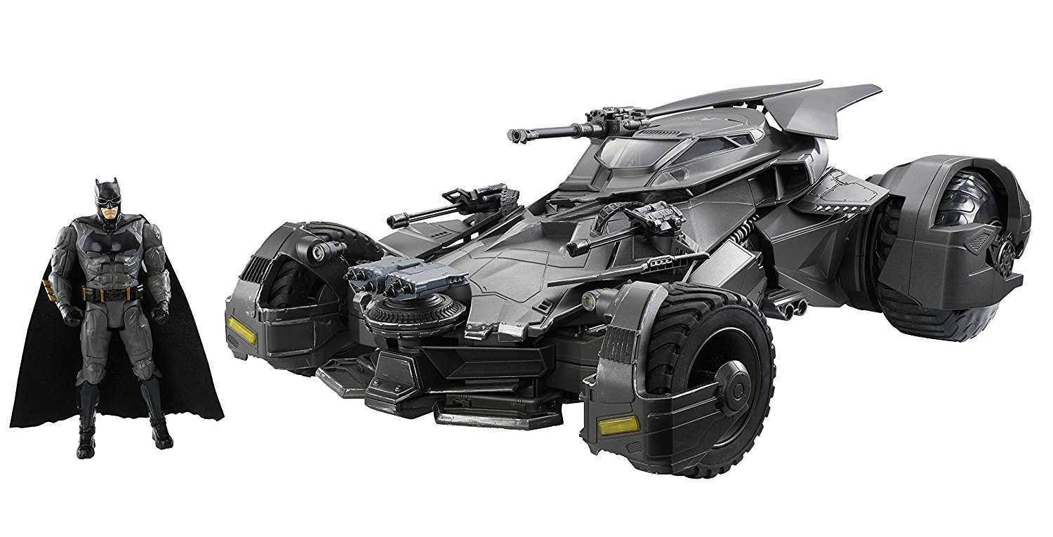 Batman Action Figure Standing Besides The Ultimate Justice League Batmobile