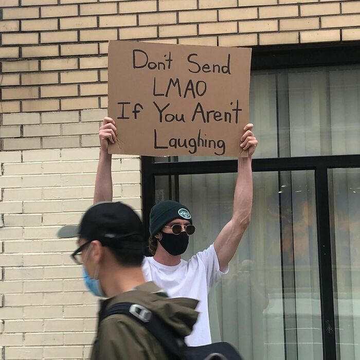 30 Hilarious Pictures Of A Man Protesting Obscure Things