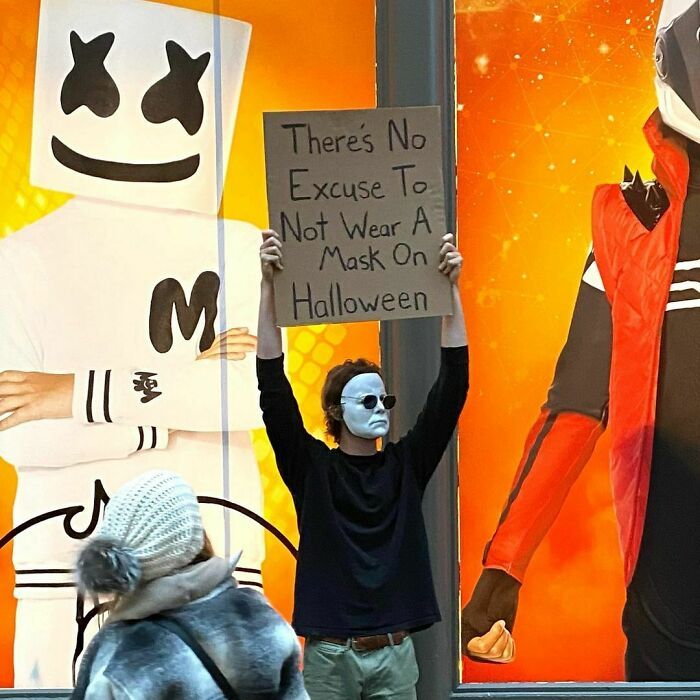 30 Hilarious Pictures Of A Man Protesting Obscure Things