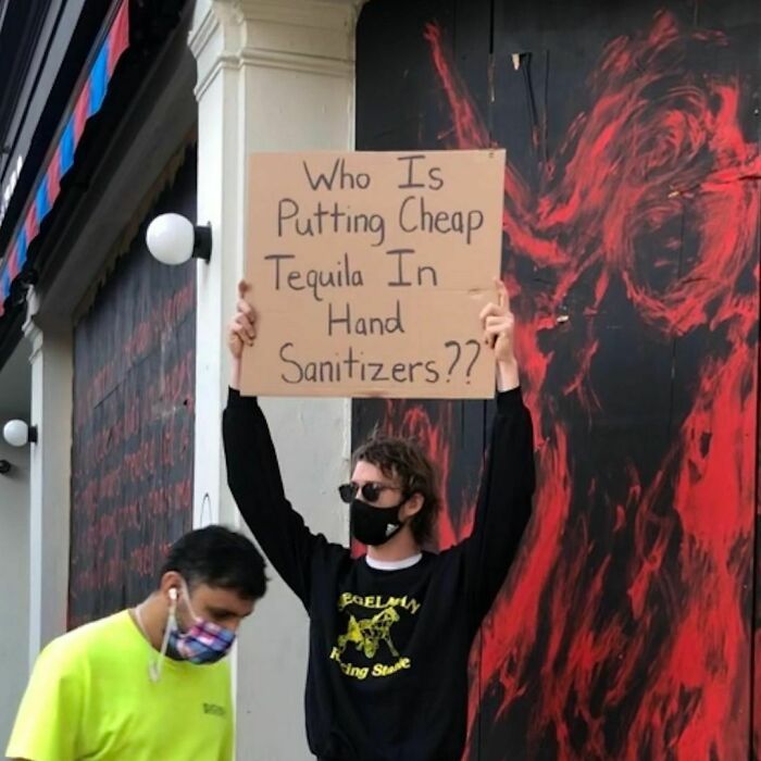 30 Hilarious Pictures Of A Man Protesting Obscure Things
