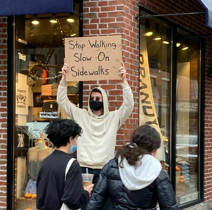 30 Hilarious Pictures Of A Man Protesting Obscure Things