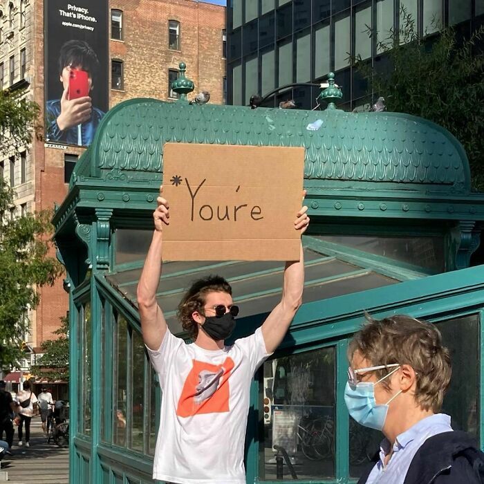 30 Hilarious Pictures Of A Man Protesting Obscure Things