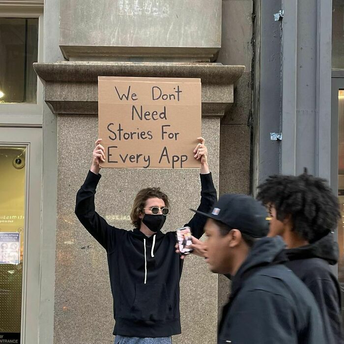 30 Hilarious Pictures Of A Man Protesting Obscure Things