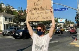 30 Hilarious Pictures Of A Man Protesting Obscure Things