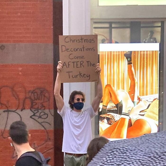 30 Hilarious Pictures Of A Man Protesting Obscure Things