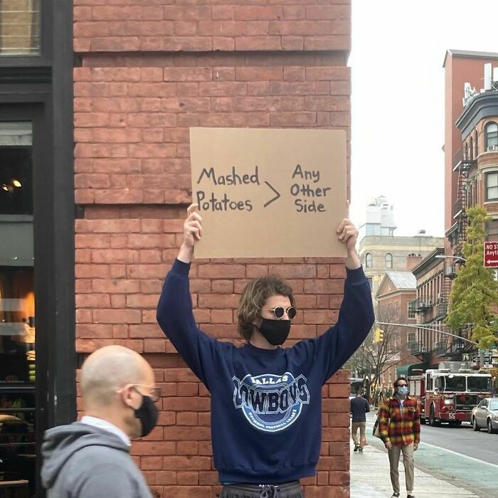 30 Hilarious Pictures Of A Man Protesting Obscure Things
