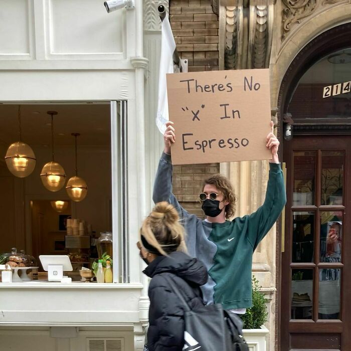 30 Hilarious Pictures Of A Man Protesting Obscure Things