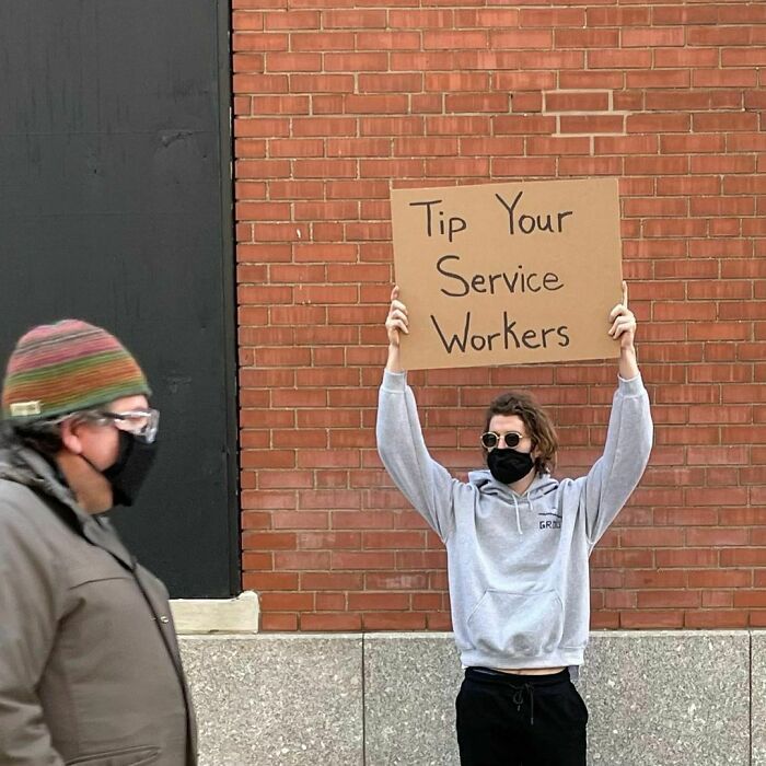 30 Hilarious Pictures Of A Man Protesting Obscure Things
