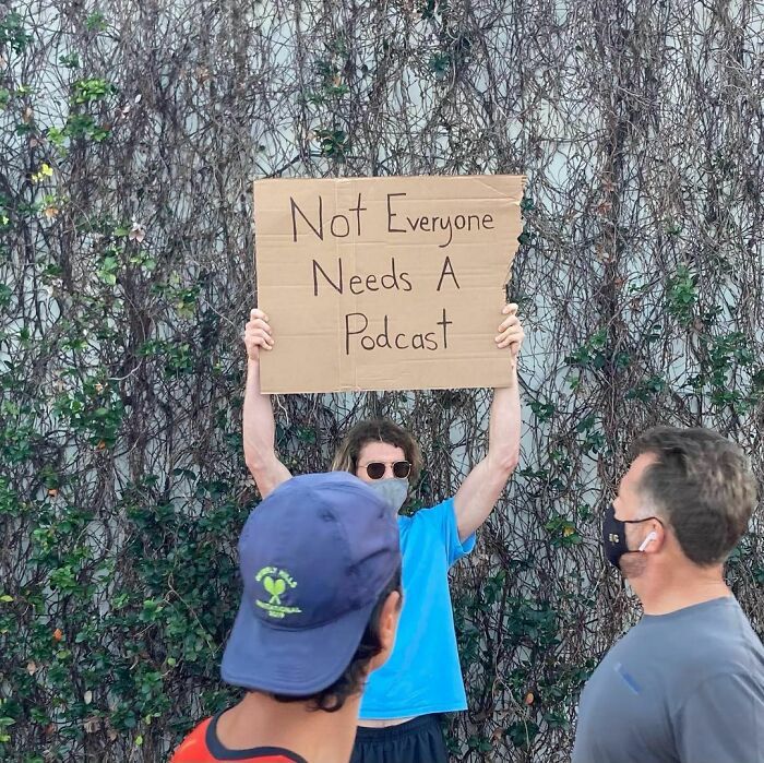 30 Hilarious Pictures Of A Man Protesting Obscure Things