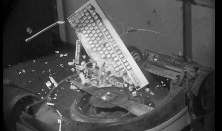 Just Dropping Stuff Into An Upside Down Lawnmower  In Slow Motion Featured