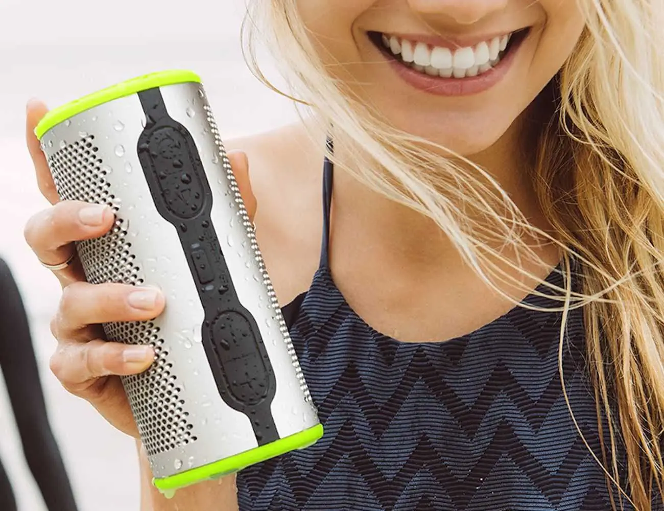 Girl Holding The Braven Stryde 360 Waterproof Speaker