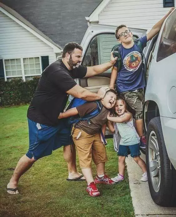 Meme Showing A Dad Trying To Stuff His Kids Into The Car While His Kids Try To Resist