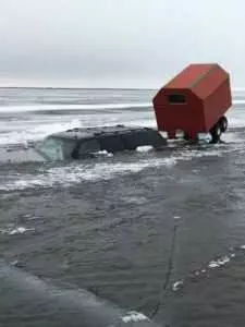 Truck Submerged In Iced Over Lake