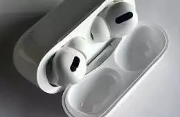 Apple Airpods Pro In Case On White Table