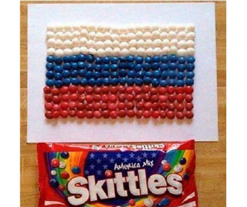 A Russian Arranging America Mix Skittles Into A Russian Flag