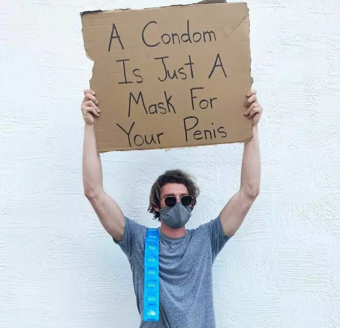 30 Hilarious Pictures Of A Man Protesting Obscure Things