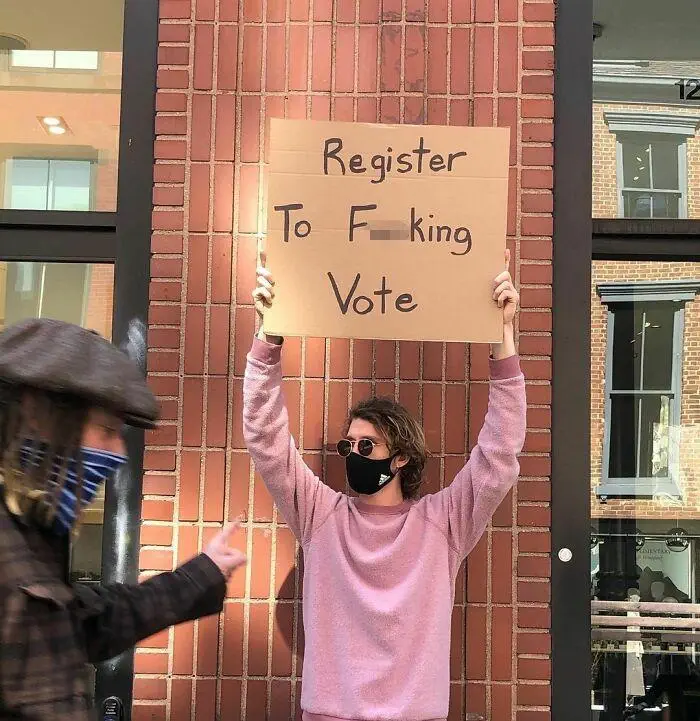 30 Hilarious Pictures Of A Man Protesting Obscure Things