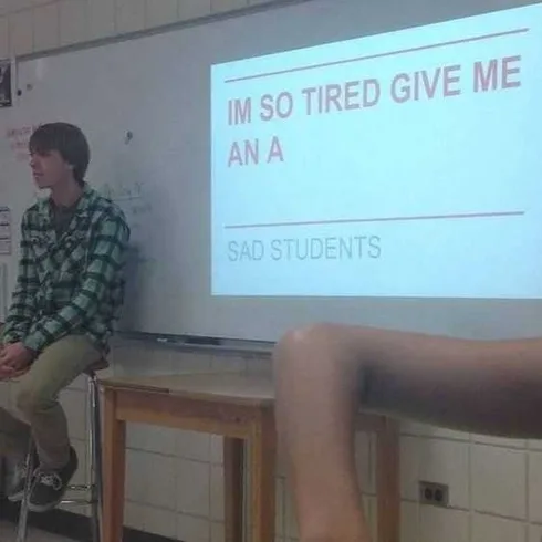 Student Meme Of A Student Sitting In Front Of A Projector Captioned I'm So Tired Give Me An A